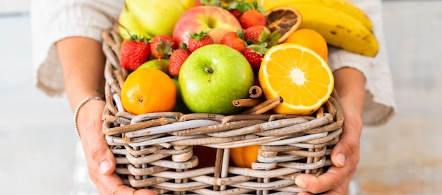 Close up of basket fruit colorufl season owner store concept Healthy food and lifestlyle people Apple orange bananas strawberry People and dieting weight loss concept Life care body Buying fruits