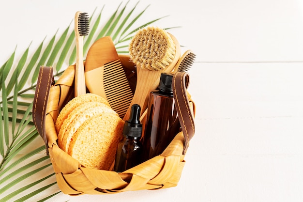 Close-up of bathroom beauty set in wooden basket on white background. persona accessories on a table