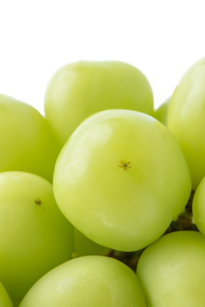 Close up of beautiful a bunch of shine muscat green grape isolated on white background, clipping path cut out