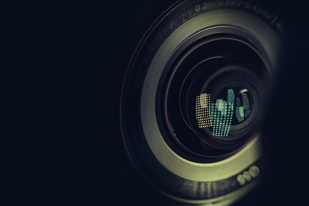 CLOSE UP Beautiful camera lens with light reflection on a black Background pattern for design