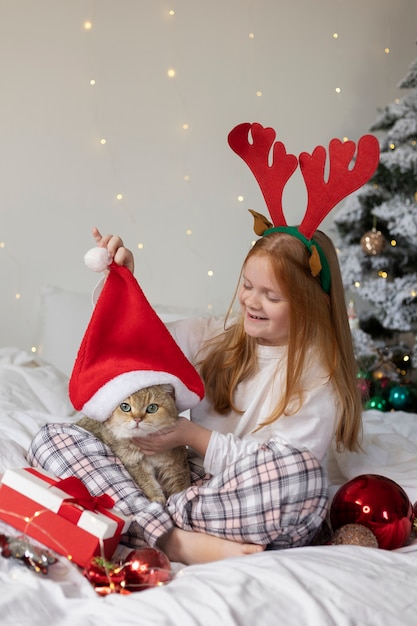 Photo close up on beautiful cat with little girl