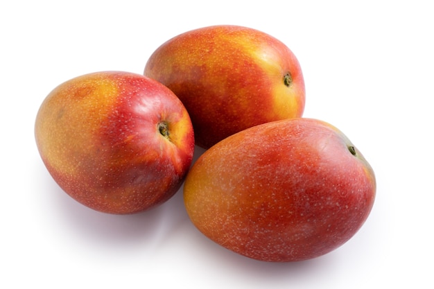 Close up of beautiful delicious ripe mango isolated on white table background, clipping path cut out.