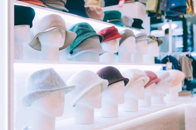 Close-up. Beautiful hats on a shop window.