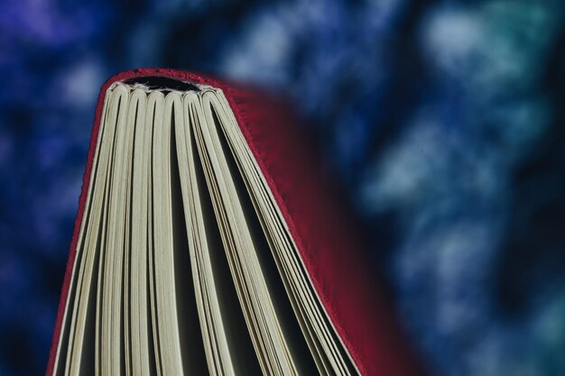 Photo close up beautiful notebook and pen on a multi colored background