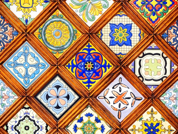 Close up beautiful vintage pattern of colorful stained glass window moroccan style background. Close-up classic pattern of wooden stained glass.