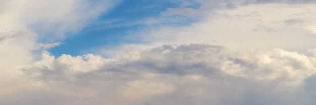 Close up on beautiful white clouds on a blue sky