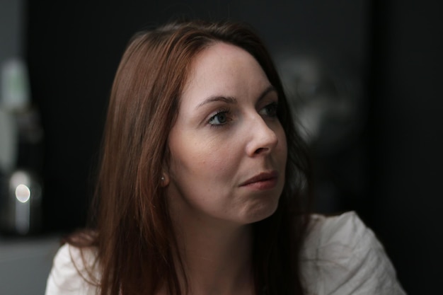 close-up of beautiful woman looking away