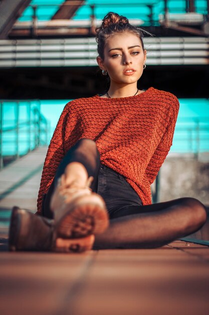 Close-up of a beautiful woman posing in urban scene