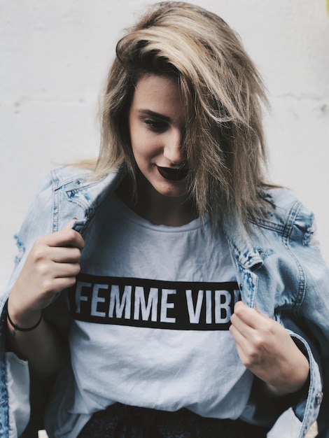 Close-up of beautiful woman wearing denim jacket