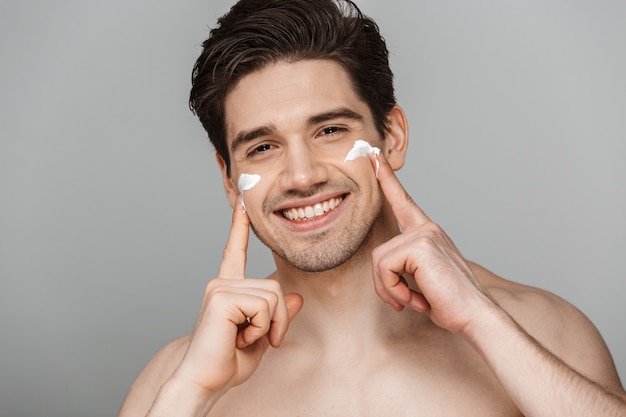 Close up beauty portrait of half naked happy young man