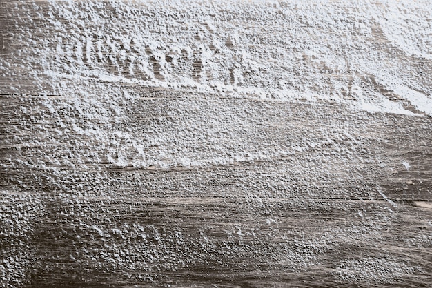 Close-up beeld van besneeuwde houten tafel