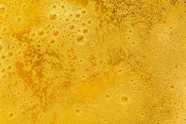 Close up of beer bubbles and foam as a background