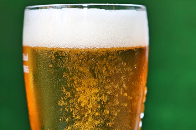 Close-up of beer glass on table