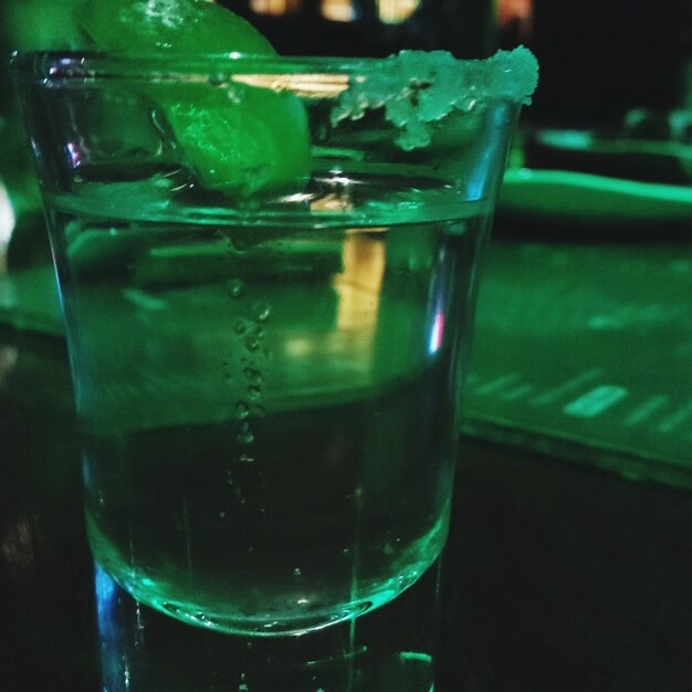 Close-up of beer glass on table