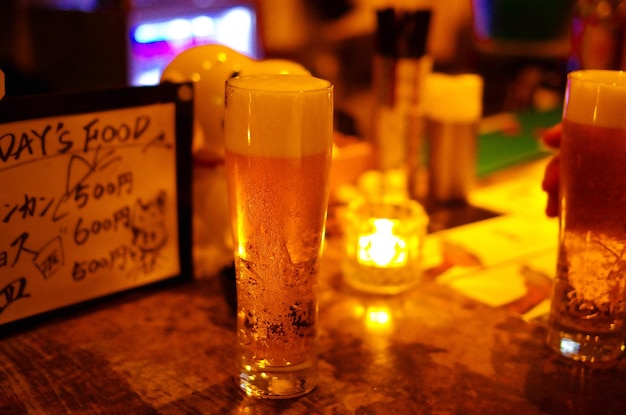 Close-up of beer glass on table