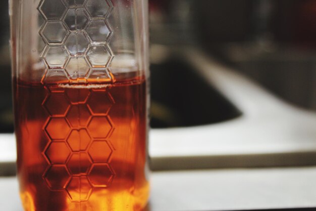 Close-up of beer glass on table