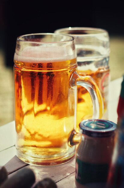 Close-up of beer in glasses on table