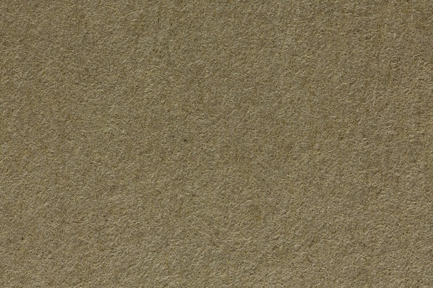 Close up of beige paper, macro shot. High resolution photo.