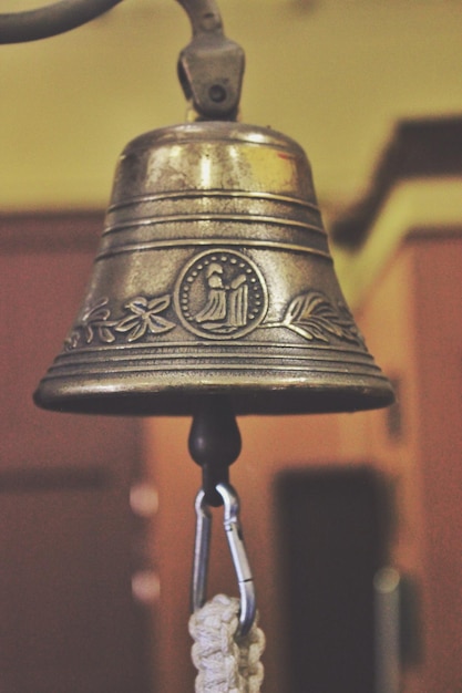 Photo close-up of bell hanging