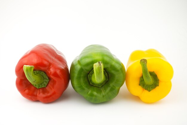 Close-up of bell peppers over white background