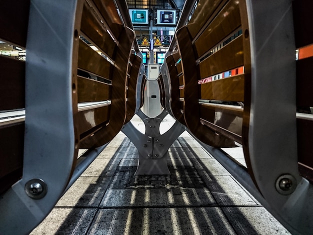 Photo close-up of benches at railroad station