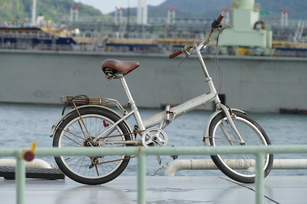 Close-up of bicycle against sea