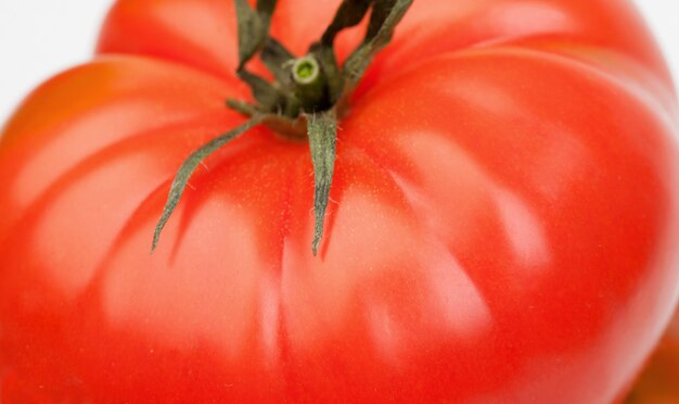 Photo close-up of a big red tomato.