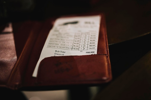 close-up of bill on table