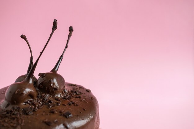 Close up birthday cake with chocolate icing and decor