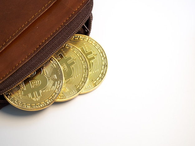 Close up bitcoin gold coins with wallet on the white background. 