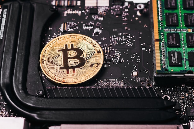 Close-up of bitcoin with computer equipment