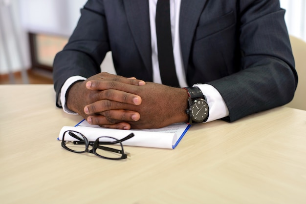 Close-up of a black businessman keeping fingers.