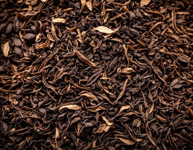 Close up black dry tea leaves wallpaper background Texture full frame banner or poster dried tea Dark abstract food and drink backdrop Advertising concept High quality photo Copy ad text space