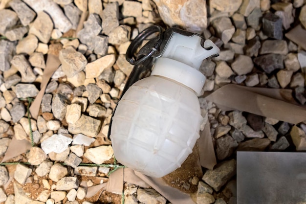 Close up of an black grenade on ground