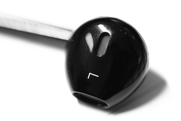 Close-up of black headphones on white background