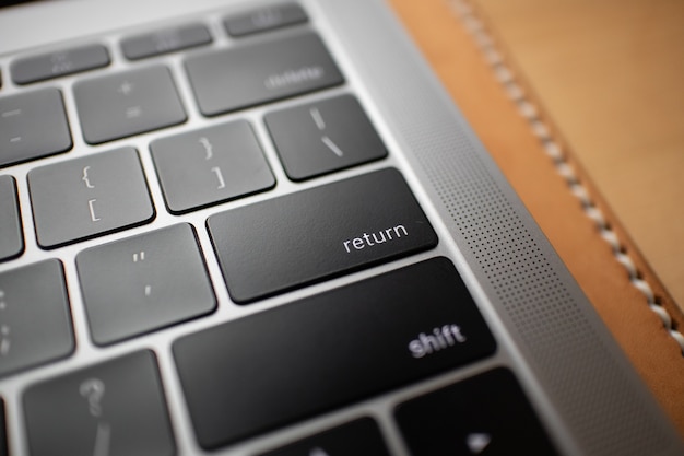 Close up of black keyboard button of a laptop.