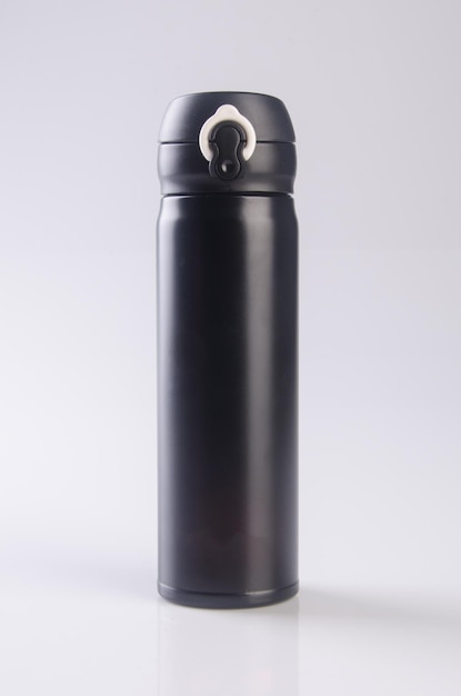 Close-up of black water bottle against white background