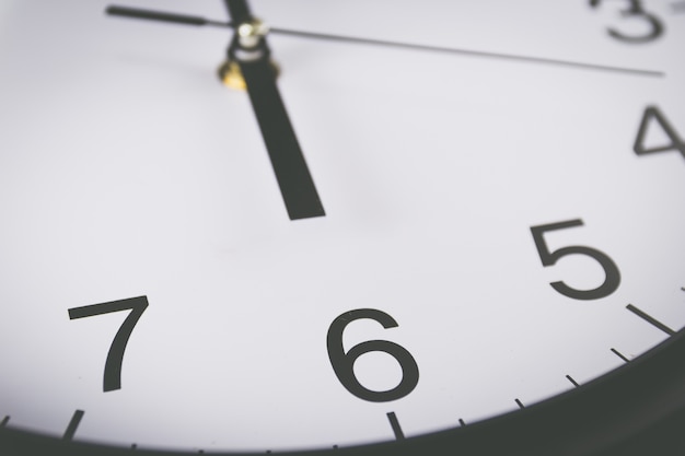 Close up of black and white analog clock 