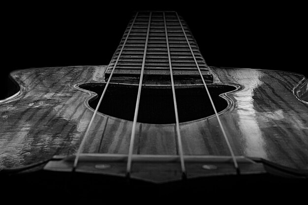 Photo close-up of a black and white ukulele