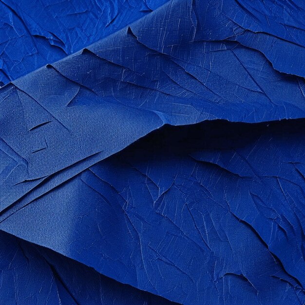 Close up of blank dark blue crumpled and creased paper