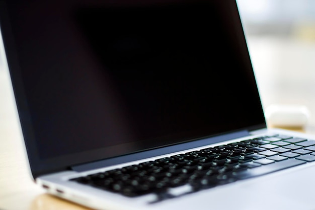 Close up of blank laptop screen with keyboard