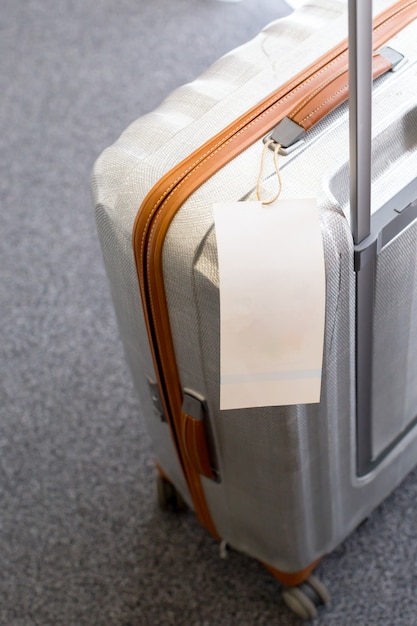 Photo close up of blank  luggage tag label on a suitcase