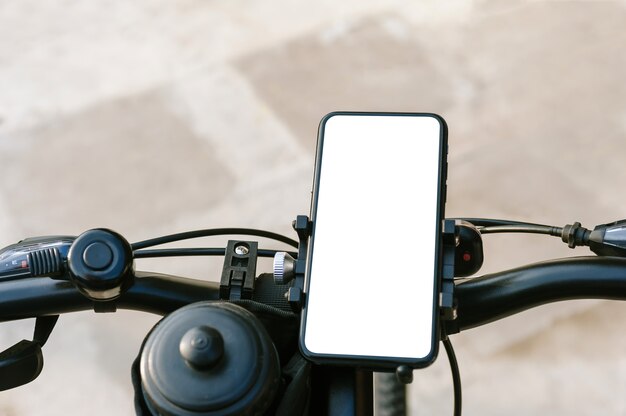 Close up on blank mobile phone on a bike