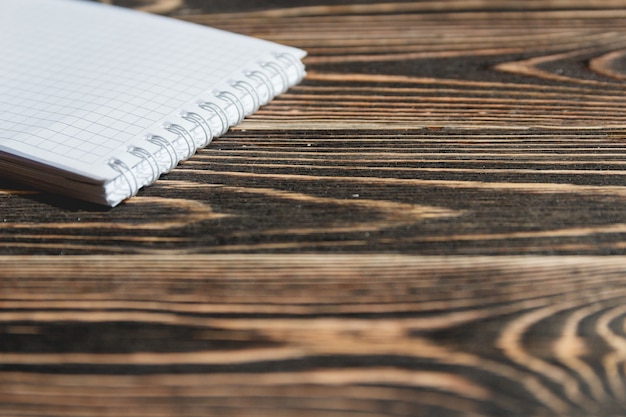 Close up Blank Note Book on Grunge Wood