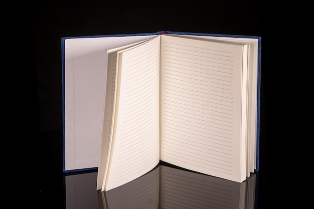 Close up of a blank velour fluffy notebook on black background with clipping path