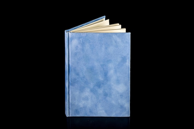 Close up of a blank velour fluffy notebook on black background with clipping path