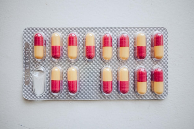 Close-up of blister pack on white background