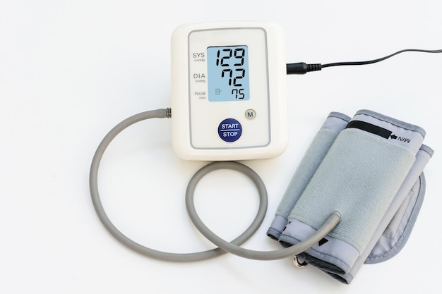 Photo close-up of blood pressure gauge on gray background