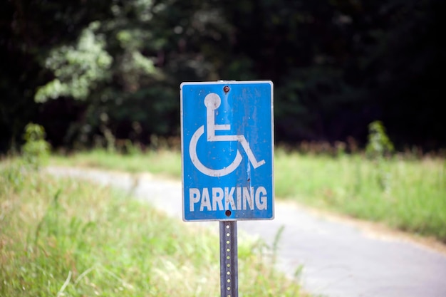 Photo close up of a blue accessible handicap parking sign