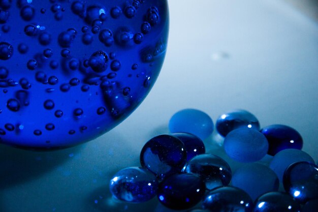 Close-up of blue of beads on table